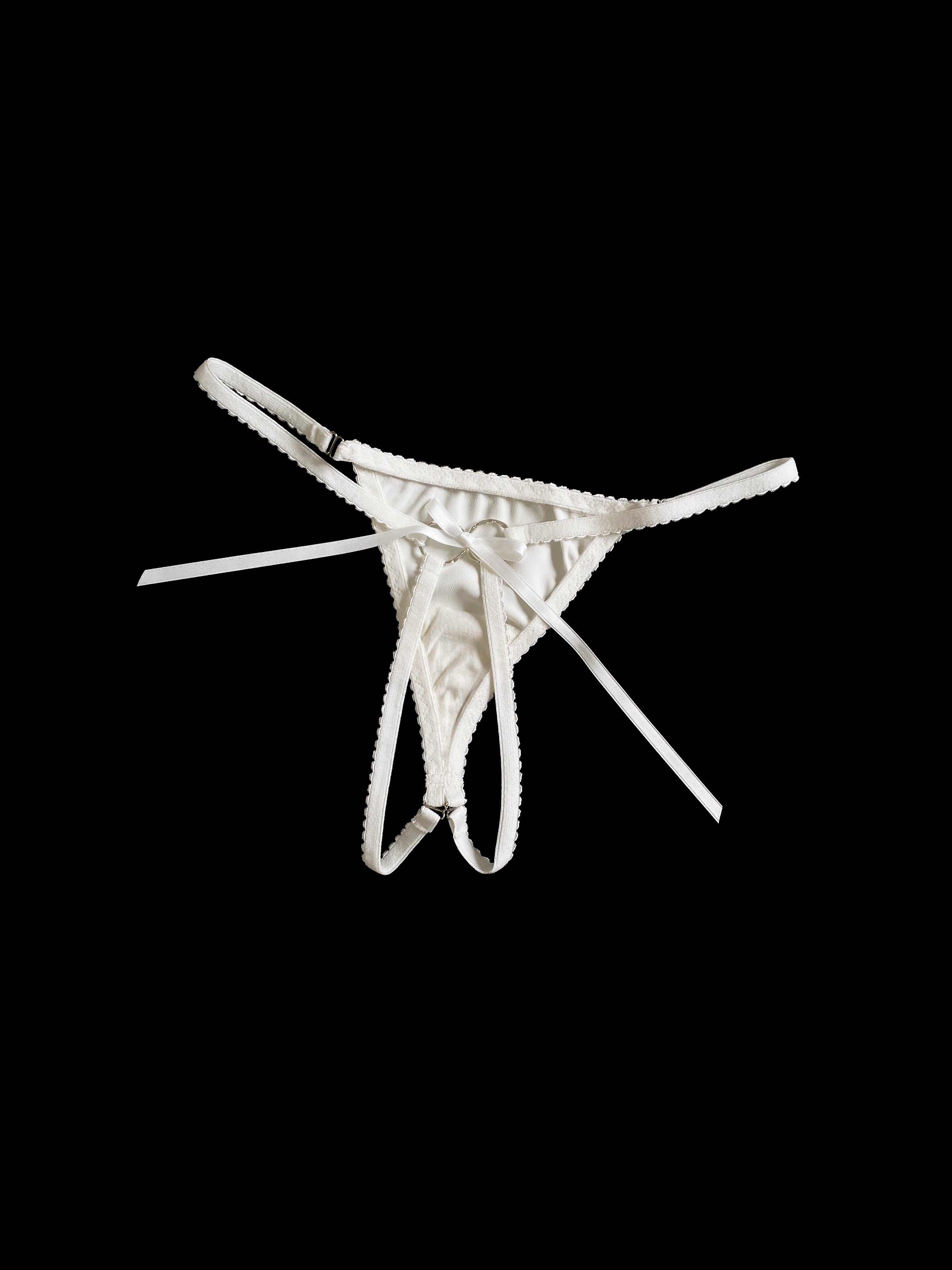 White thong on a black background