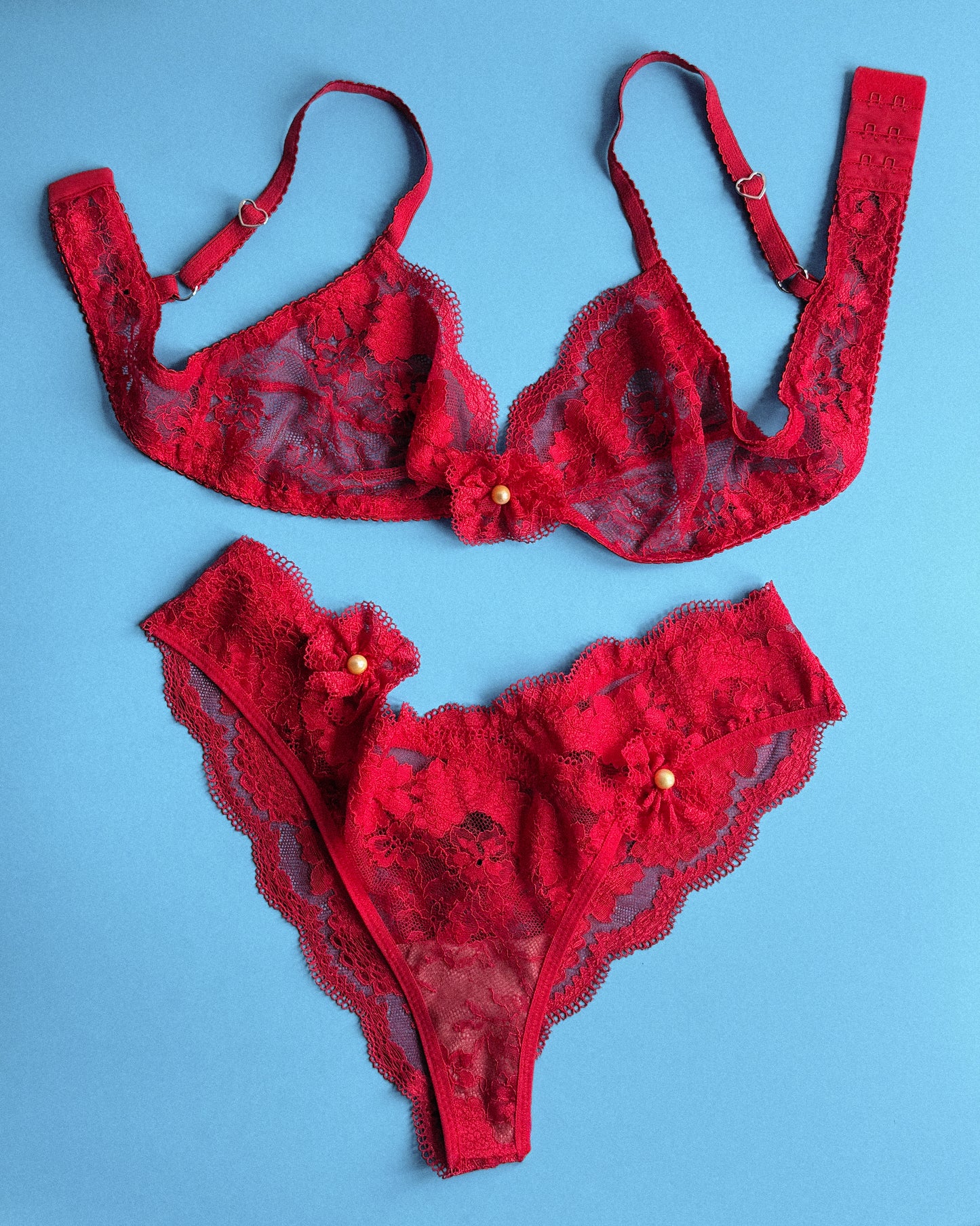 Red lace lingerie set on a blue background