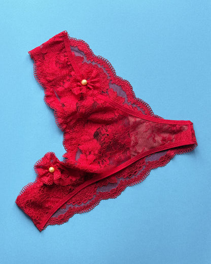 red lingerie slip on a blue background