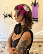 Caviar handmade statement brooch featuring a silver-toned paisley appliqué and decorative feathers, designed as a lingerie and clothing accessory.