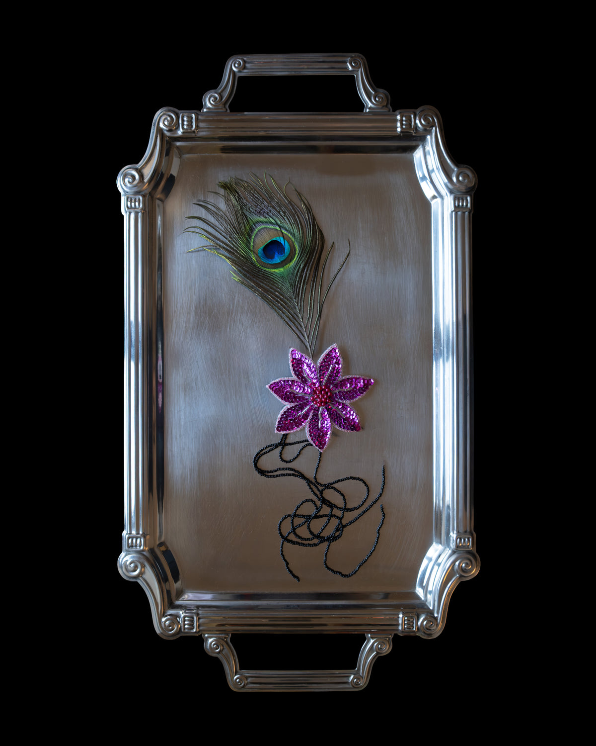 Crevette handmade decorative lingerie pin featuring a vibrant magenta beaded appliqué and an elegant peacock feather.