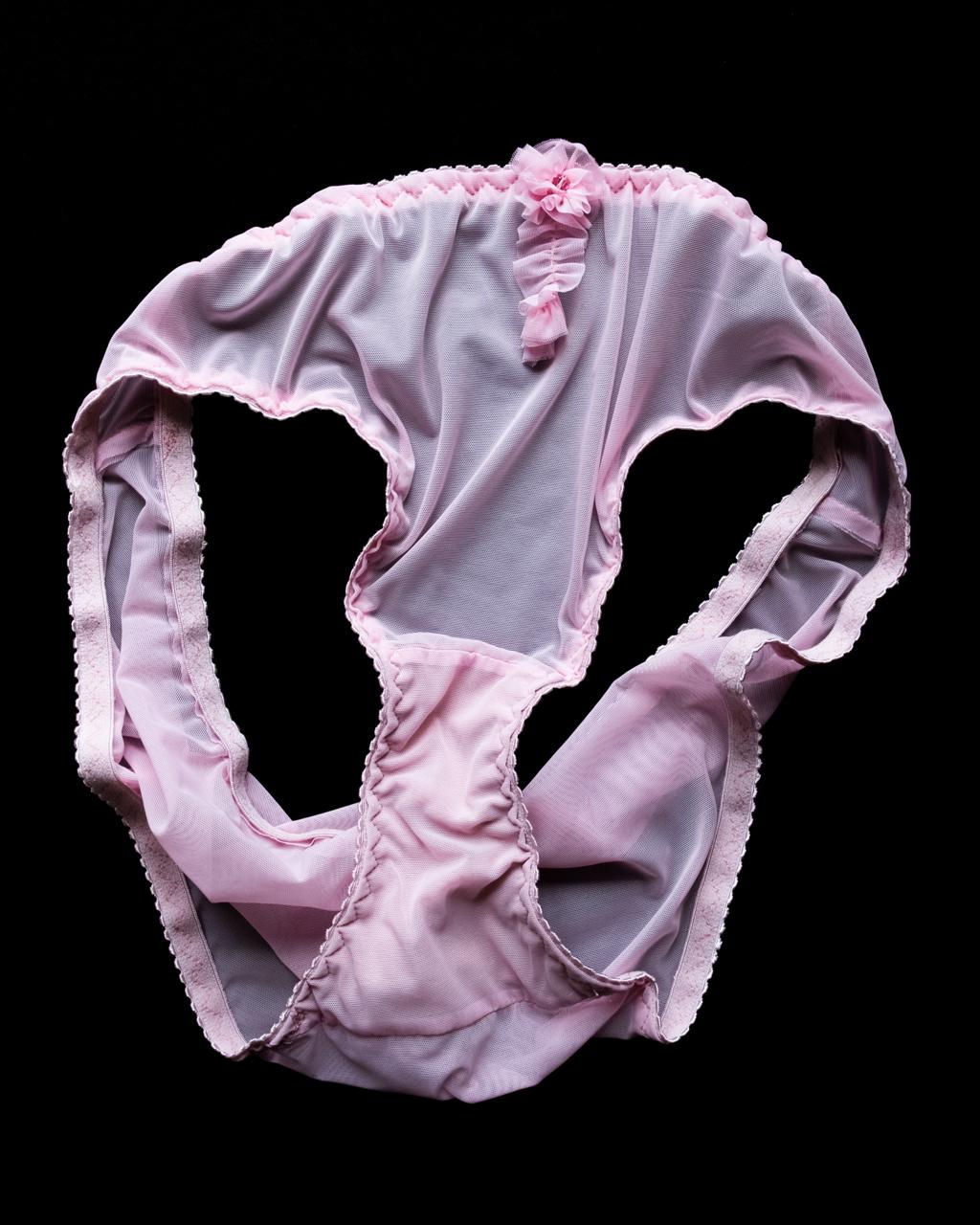 Tenera handmade Italian bikini brief in hibiscus pink stretch mesh, featuring delicate handmade appliqués and sparkling Swarovski crystal embellishments.