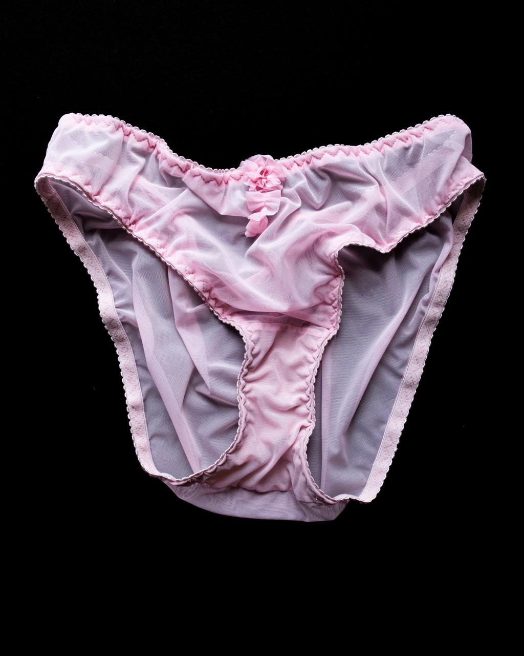 Tenera handmade Italian bikini brief in hibiscus pink stretch mesh, featuring delicate handmade appliqués and sparkling Swarovski crystal embellishments.